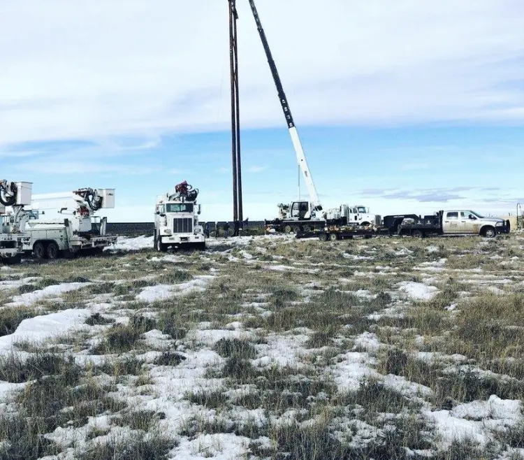 Four Vehicles at the Power Line Project Field