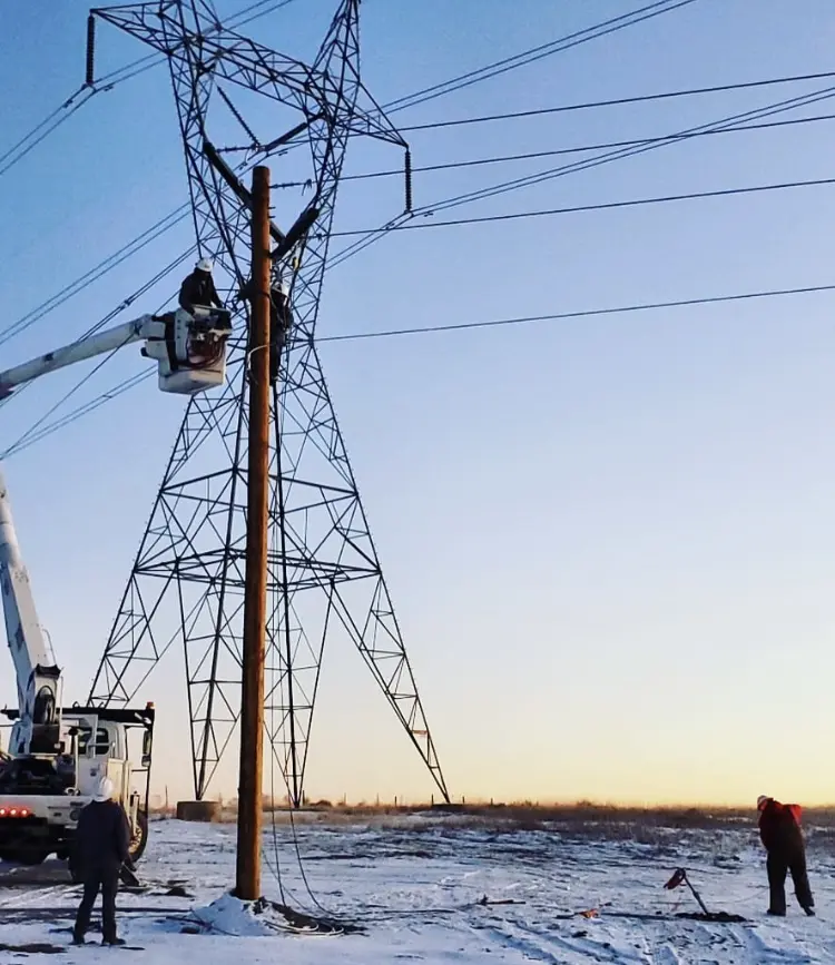 Men Working near The Transmission tower