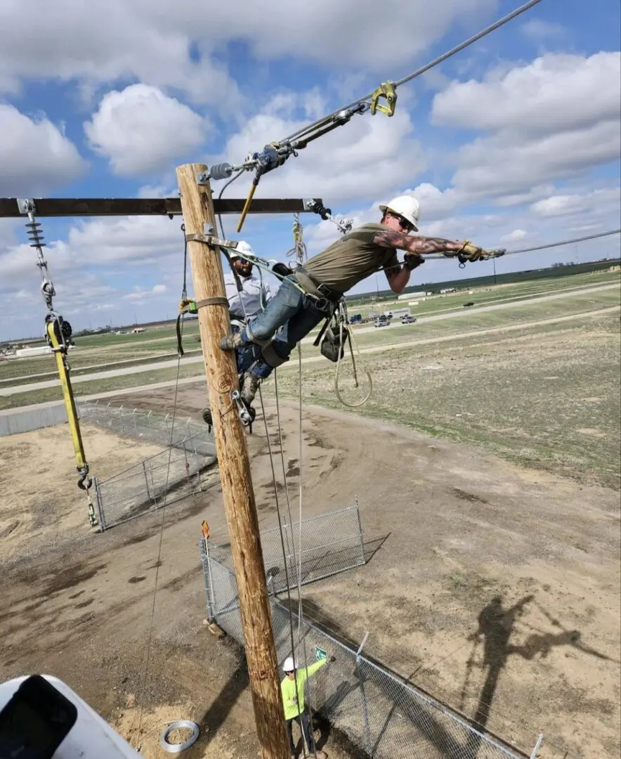 A man is working on a power line